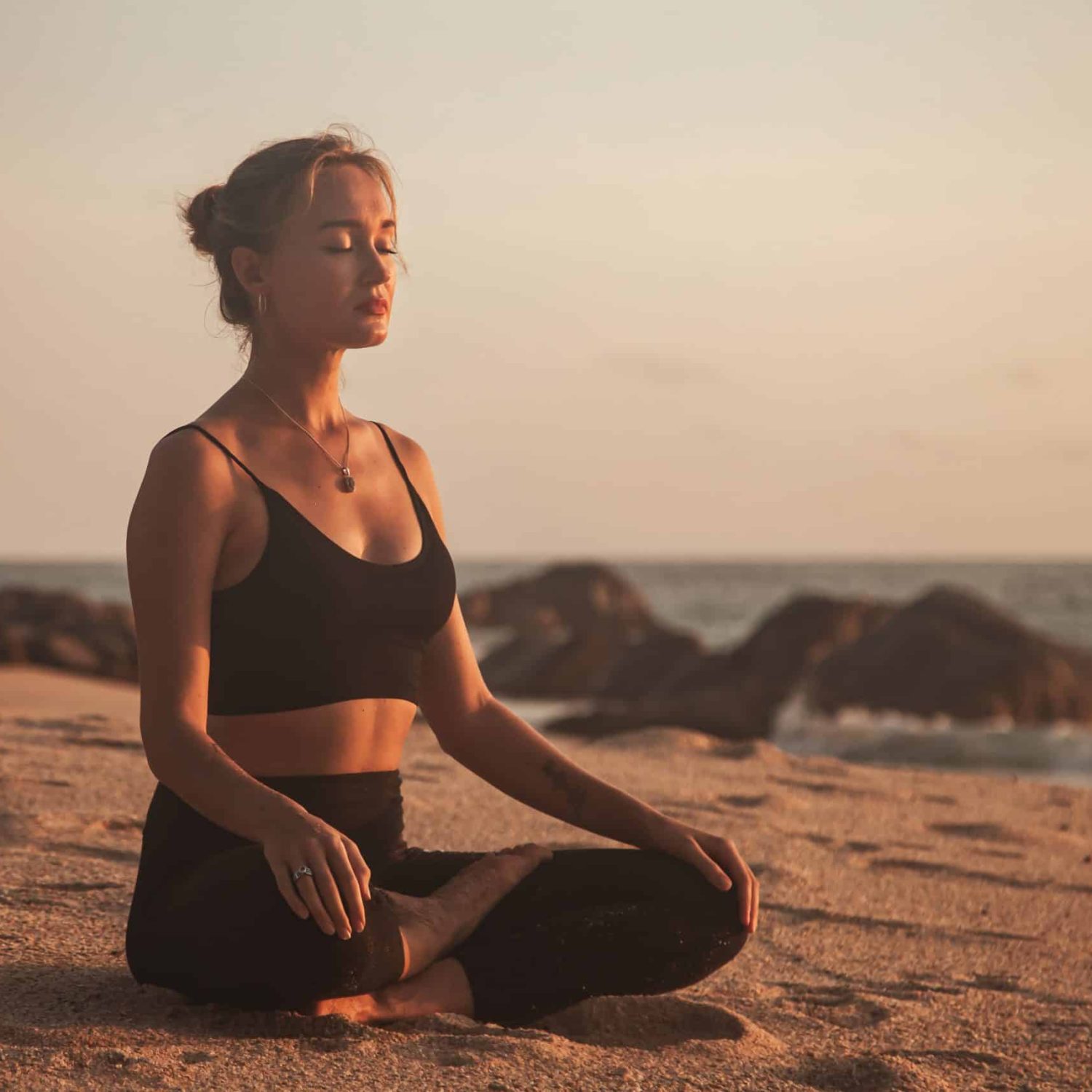 A Young Woman Does Yoga And Meditation On A Sandy 2023 11 27 05 31 00 Utc