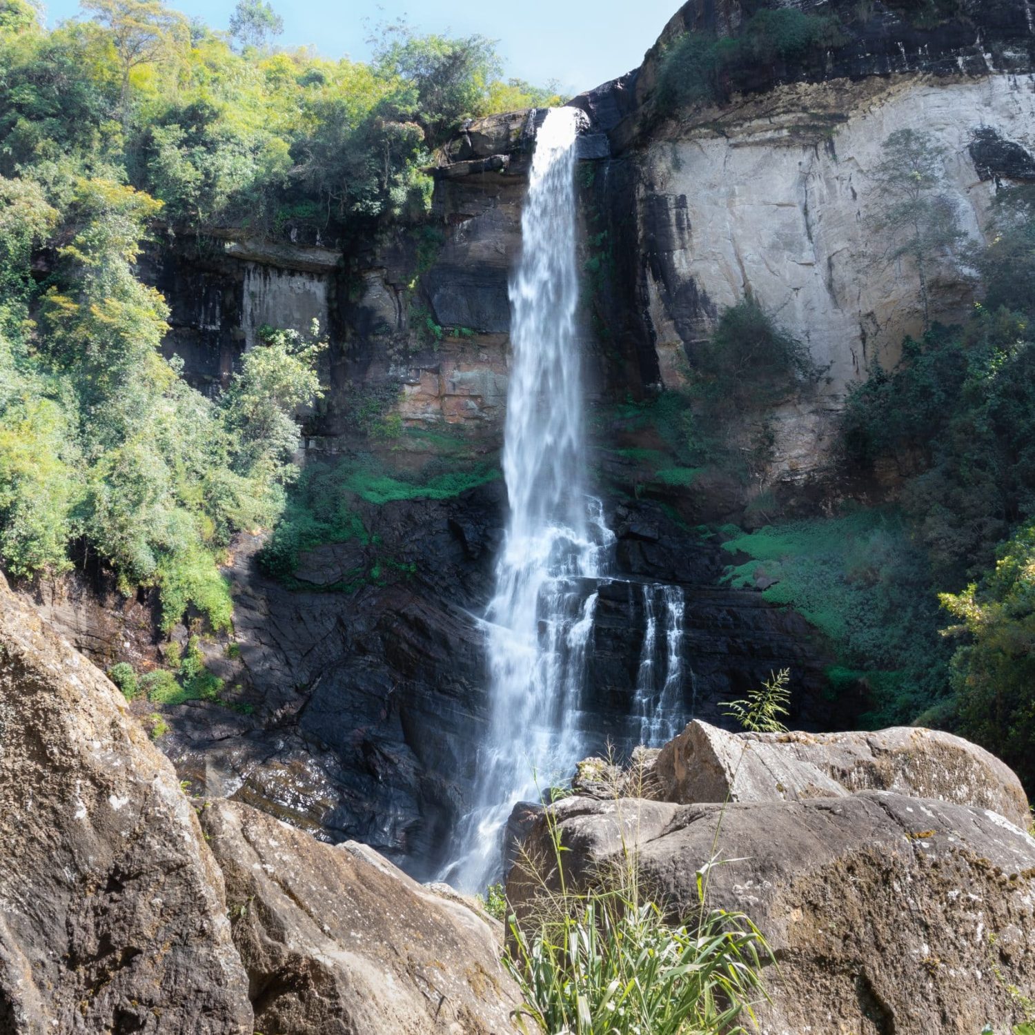 Beautiful Ramboda Falls Landscape Photograph. It's Also Going By The Name Of Puna Ella. A Powerful Stream Of Water Falling Down Through The High Rocky Mountain,